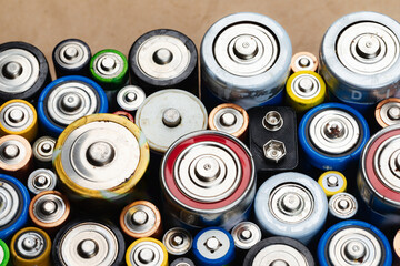 Assorted Used Batteries on a Brown Paper