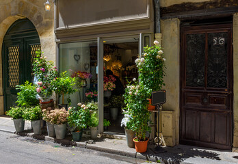 Street with flower shop in Paris, France. Cozy cityscape of Paris. Architecture and landmarks of Paris. - 737186986