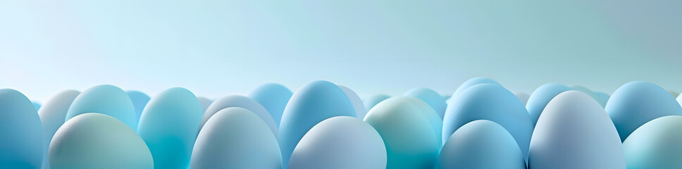 Gradient Hues: A Serene Collection of Blue Tinted Eggs on a Warm Pastel Background