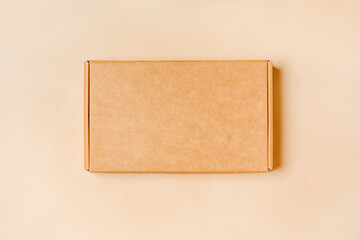 Eco-Friendly Packaging: Top View of Cardboard Box on Beige Background