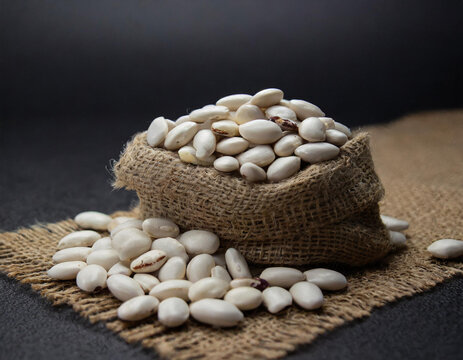 white beans on eco fabric, product photography, food, restaurant, macro, black background
