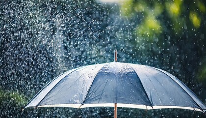 transparent umbrella under heavy rain against water drops splash background rainy weather concept