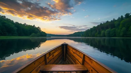Fotobehang Calm lake with morning skies above view from wooden boat © Rosie