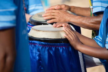 Percussionist hands playing atabaque. musical rhythm. African music.