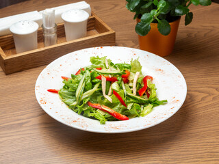 Salad of chicken, cucumber, pepper, lettuce. Lunch.