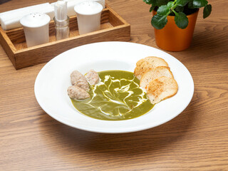 Broccoli soup with croutons in a bowl. Lunch.