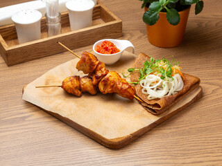 Chicken kebab on a skewer. Lunch.