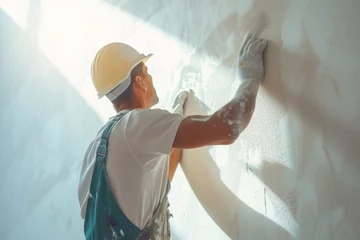 Tapeten A painter polishes and sands white walls after puttingty before painting in a new apartment banner with a wide angle lens in daylight © เลิศลักษณ์ ทิพชัย