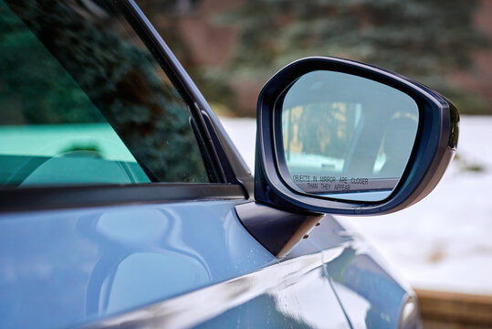 Minsk, Belarus. Jan 28, 2024. Rear view mirror of Honda Civic 11th generation closeup. Side mirror of Honda car, exterior detail. Sonic Grey Pearl Color Honda Civic 11.