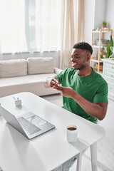 happy deaf african american freelancer using sign language for communication during video call © LIGHTFIELD STUDIOS