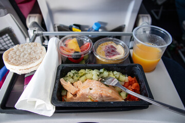 food on the plane. fish and fruits