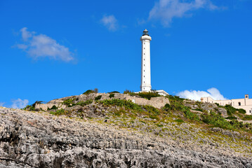 Fototapeta na wymiar Punta Meliso and the lighthouse of Santa Maria di Leuca built in 1864, 47 meters high, the second tallest in Europe Italy
