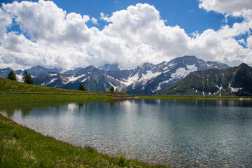 Fototapeta na wymiar Valbiolo Lake and Adamello Mountain, Passo del Tonale, Italy