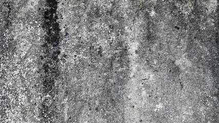 Textured gray concrete surface with natural patterns, suitable for backgrounds or graphic designs
