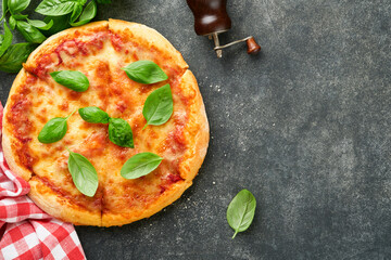 Margarita pizza. Traditional neapolitan margarita pizza and cooking ingredients tomatoes basil on...