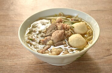 boiled slice soft and chop pork and meatball in clear soup on bowl 