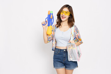 Young Asian woman in summer outfits wearing plastic glasses and holding water guns plastic for Songkran festival in Thailand isolated on white background - 737281333