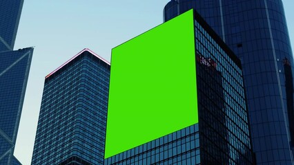 Night City large billboard with a green screen for advertising on the building wall.