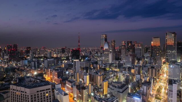 tokyo city downtown aerial view timelapse from night to day minato ward district,high point of view time lapse of modern urban town business buildings and skyscrapers 