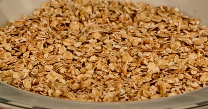 Close up video of a plate full of spelled flakes - they are a good source of protein and rich in fiber.