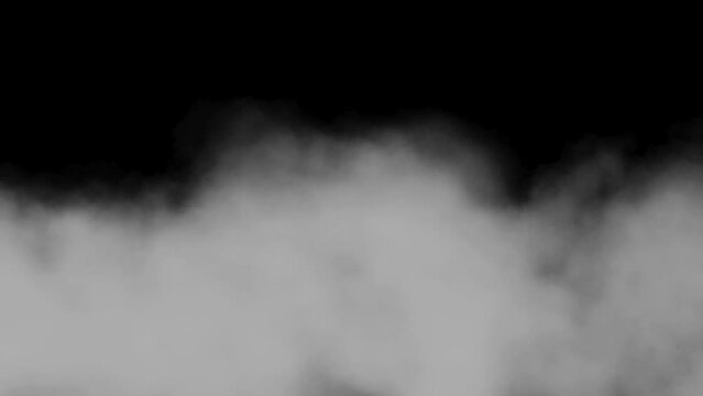 floating smoke fog clouds overlay on black night background. Huge smoke slowly moving on black background. 
