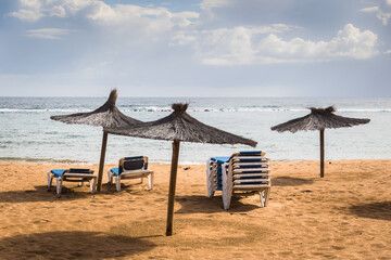 beach chairs and umbrellas