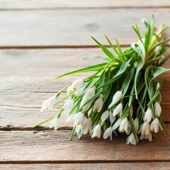 Bunch of crocus and snowdrops on the wooden table.