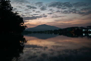 Tranquil Lake Scene at Twilight with Mountain Silhouette