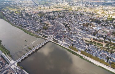 Fototapeta premium Riverside Tapestry: An Aerial Symphony of Blois, Loir-et-Cher, and the Majestic Val De Loire