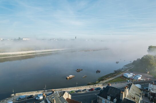 Misty Whispers: Enchanting Fog Blankets Boats on Loire, Blois, Val De Loire