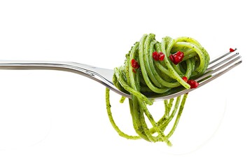  tasty green spaghetti with droplets of sauce on a fork isolated on white background