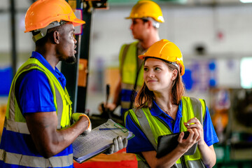 Concept workers people operation in industrial. team of factory industrial warehouse. Male giving some advice to team. Group of Diversity engineer factory people meeting.