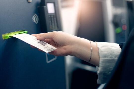 automatic ticket terminal,  young woman buying tickets for public transportation
