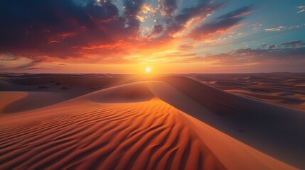 the sun is setting over a desert with sand dunes foreground and a few clouds sky.