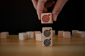 Business goal, plan, action. wooden cubes with icon business strategies, action plan, goal,...