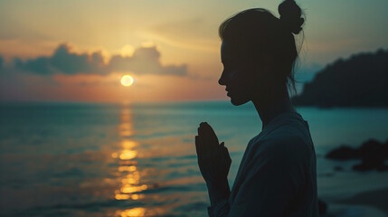 Young Woman Practicing Yoga at Sunset By the Sea: Silhouette of Female Doing Asanas, Healthy...