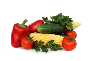 Fresh harvest of vegetables lie on a white background.