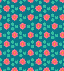 Water lily in shades of pink on ocean blue lake with turquoise green foliage