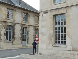Person in front of a building - École Militaire - Paris - France