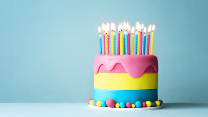 Colorful celebration birthday cake with lots of candles