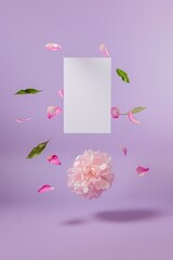 Pink flowers levitating with paper for copy space. Purple background. Spring and Summer aesthetic concept.