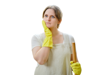 A thoughtful woman in doubt holds her head with her hand while cleaning in the home kitchen, isolated on a white background
