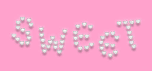 ハート形パールホワイト色のキャンディをアレンジした、浮いている"sweet"の文字。影付き、ピンク背景。