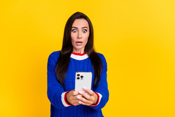 Portrait of mature lady in knit jumper confused using smartphone when someone stolen her privacy...