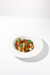 Mediterranean salad with octopus, potatoes, tomatoes, and Kalamata olives with a spicy sauce