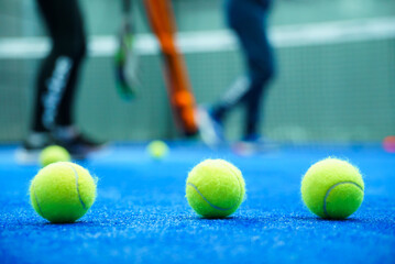 Close-up of tennis ball on blue court