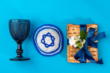 Pesah jewish Passover holiday celebration concept. Jewish kippah with a Star of David, matzah,...