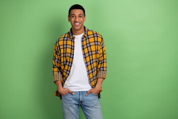 Photo of young guy in yellow plaid shirt smiling candid friendly model poses casual stylish trendy...