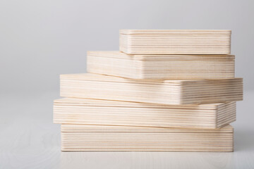 Wooden photo box for photo storage on wooden white background. Stack of boxes on white. set for the photographer, presentable set of photos, luxury feedback to client.