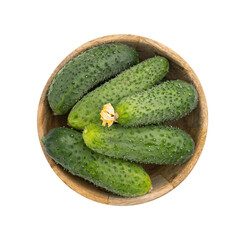 fresh cucumbers in wooden bowl